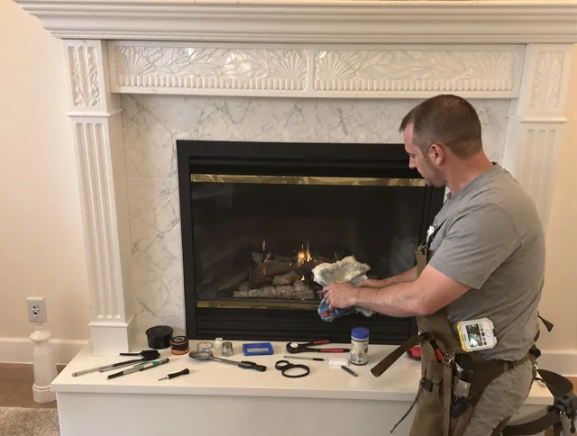 Brecksville Chimney Sweep performing fireplace maintenance in Brecksville, OH